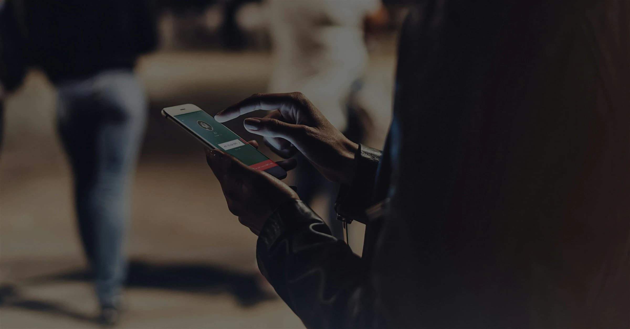 Hands holding a phone during an international call